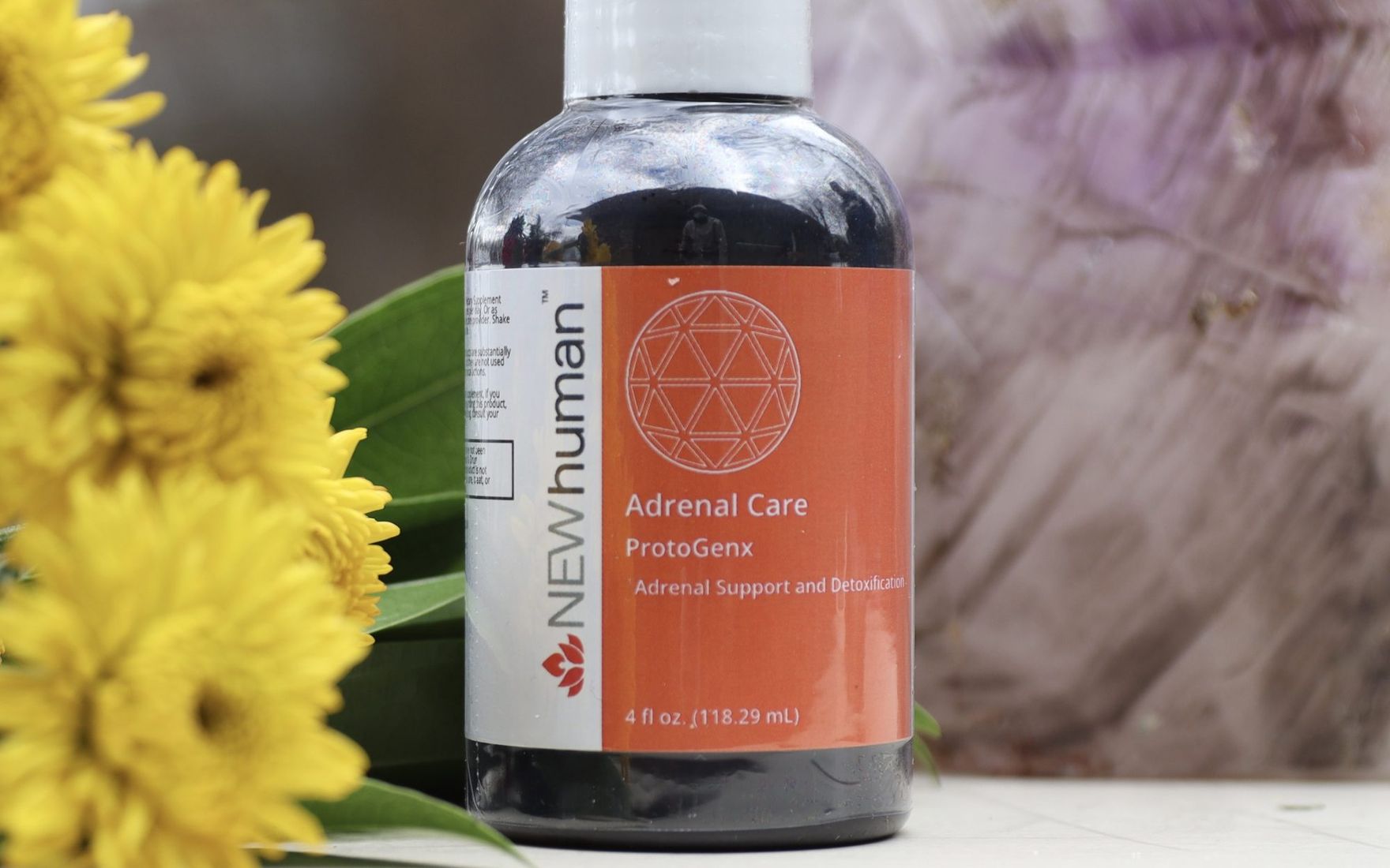 Adrenal Care 4 oz on location with flowers and stone