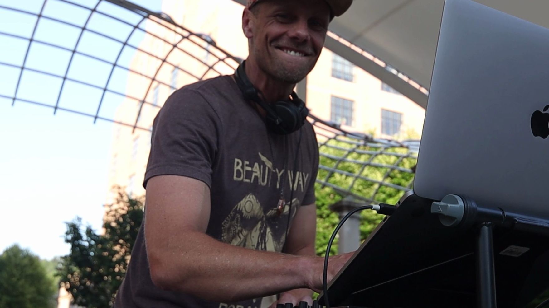 The DJ under the pavilion trellis