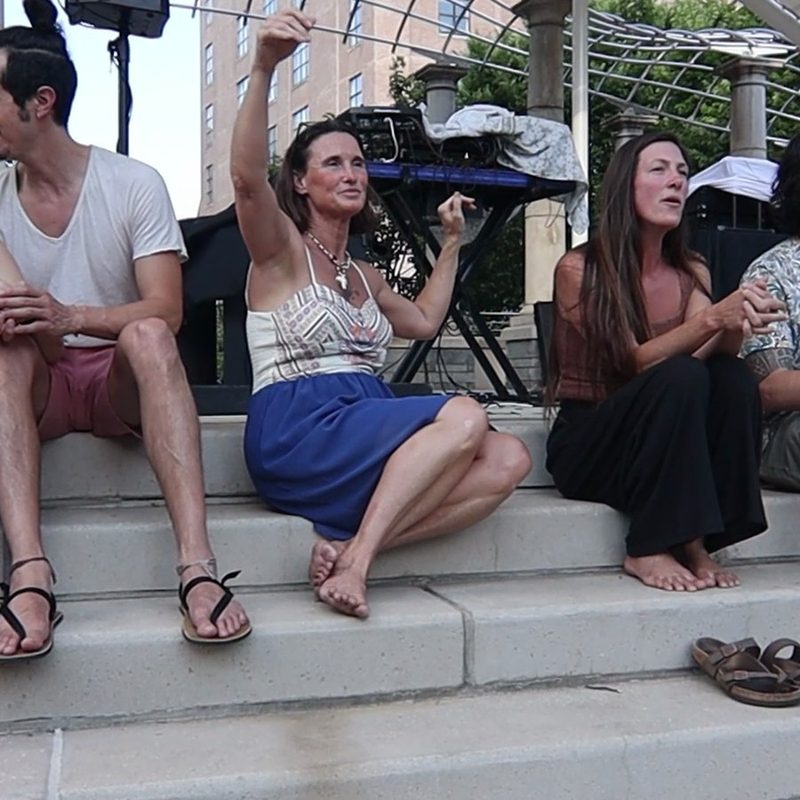 Attendees, not performers, are the subject.